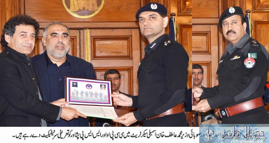 Speaker KP Assembly Asad Qaiser giving away award to police officials