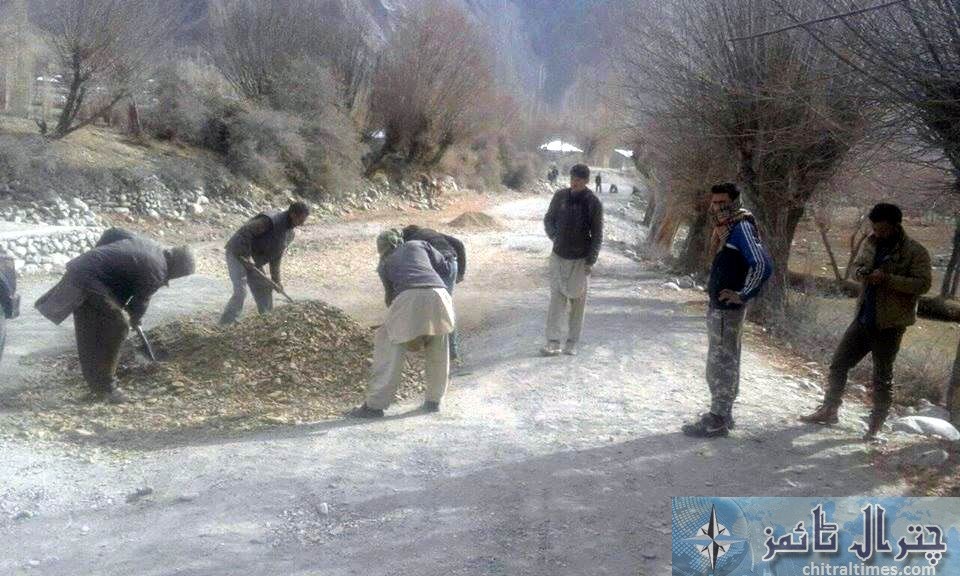 ismaili volunteers buzy on road repairing