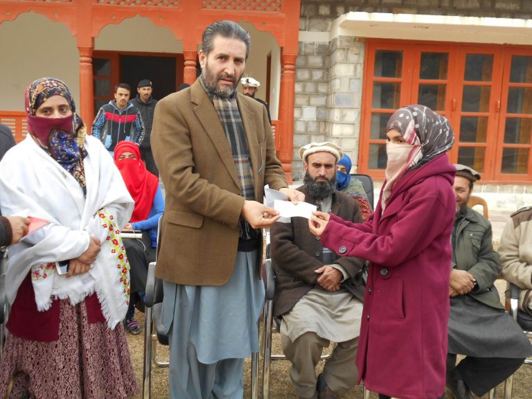district nazim chitral distributes cheques among students maghfirat shah