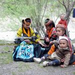 Kalasha girls preparing cloths for upcoming festival