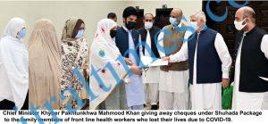 CM distributes cheques among health workers family members shuhada package