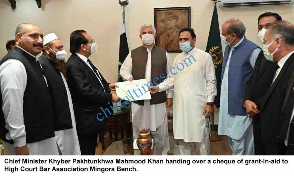 cm kp mahmood khan handling over a cheque to phc bar assocaition mangora scaled