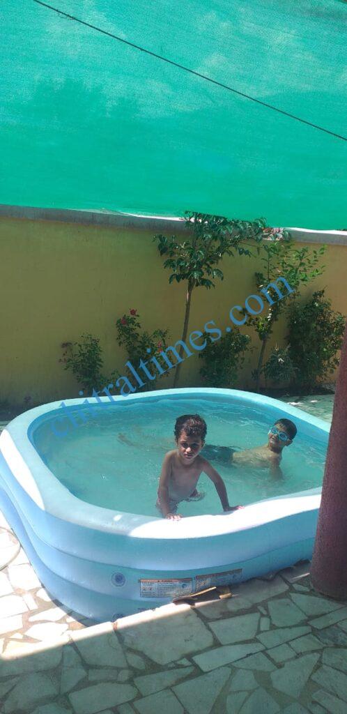 chitraltimes chitral garmi nala child swiming2