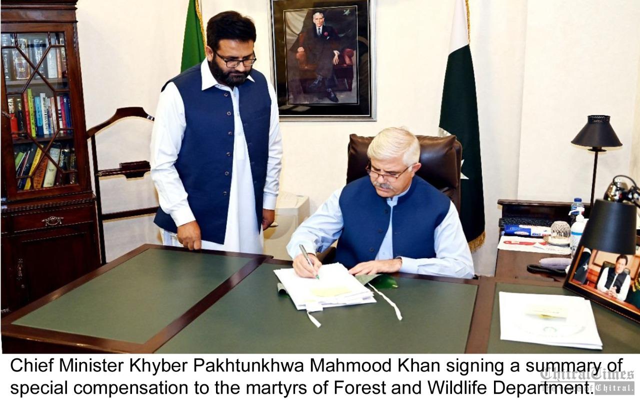 chitraltimes cm kpk signing sumnmary of special compensation to the martyrs of forest and wildlife dept