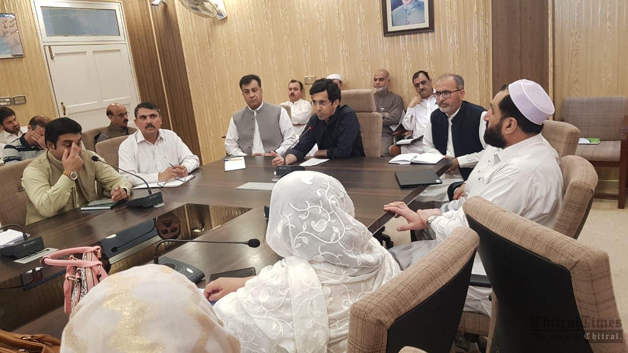 chitraltimes shahram khan tarakai chairing edeo meeting1