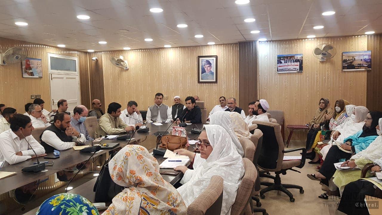 chitraltimes shahram khan tarakai chairing edeo meeting2
