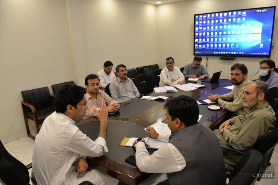 chitraltimes minister education chairing meeting on development schemes