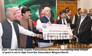 chitraltimes cm mahmood khan giving away cheque to phc swat bar association