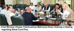 chitraltimes cm kp chairing meeting on sehat card plus