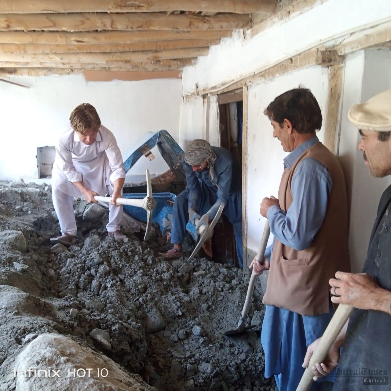chitraltimes ismaili valunteers cleaning the flood effected houses in chuinj 1