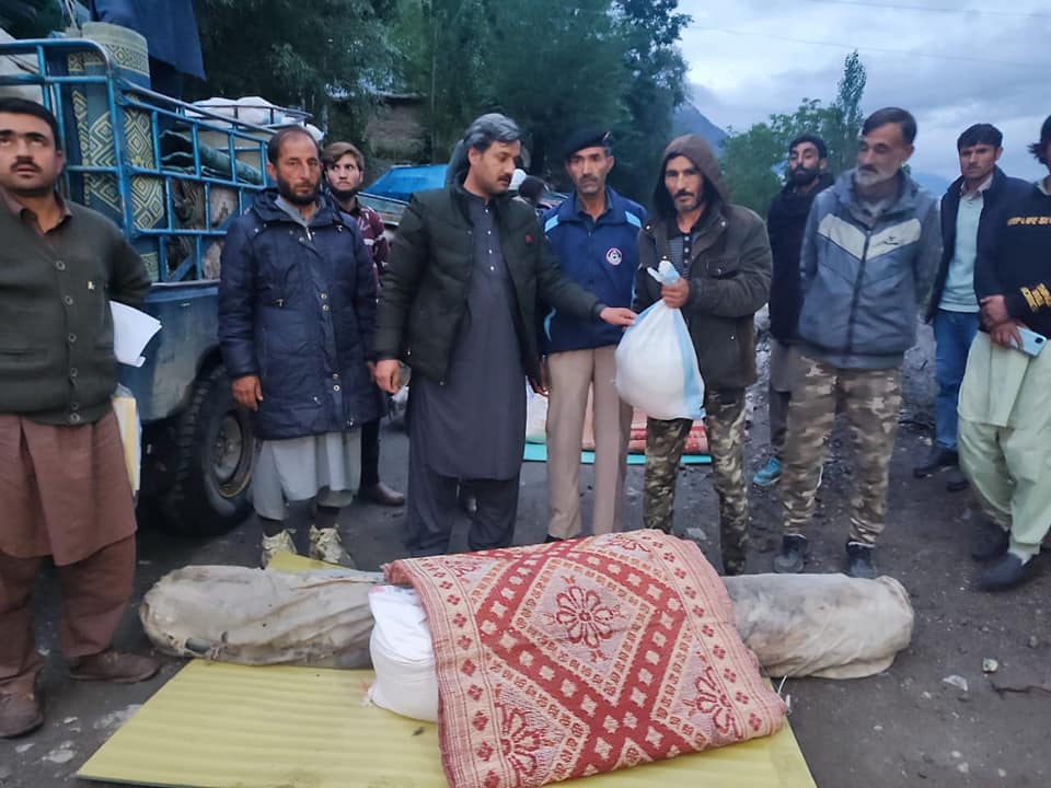 chitraltimes aac mastuj distributing relief to flood affectees of yarkhun valley2