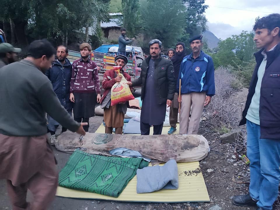 chitraltimes aac mastuj distributing relief to flood affectees of yarkhun valley3