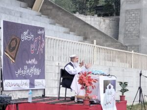 chitraltimes dr m ismail addressing chitral parade ground