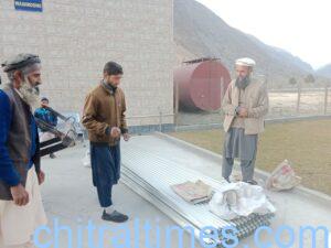 chitraltimes qari faizullah distributes steel sheets for flood affected people of chitral 3