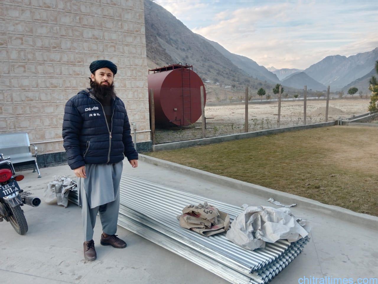 chitraltimes qari faizullah distributes steel sheets for flood affected people of chitral 5