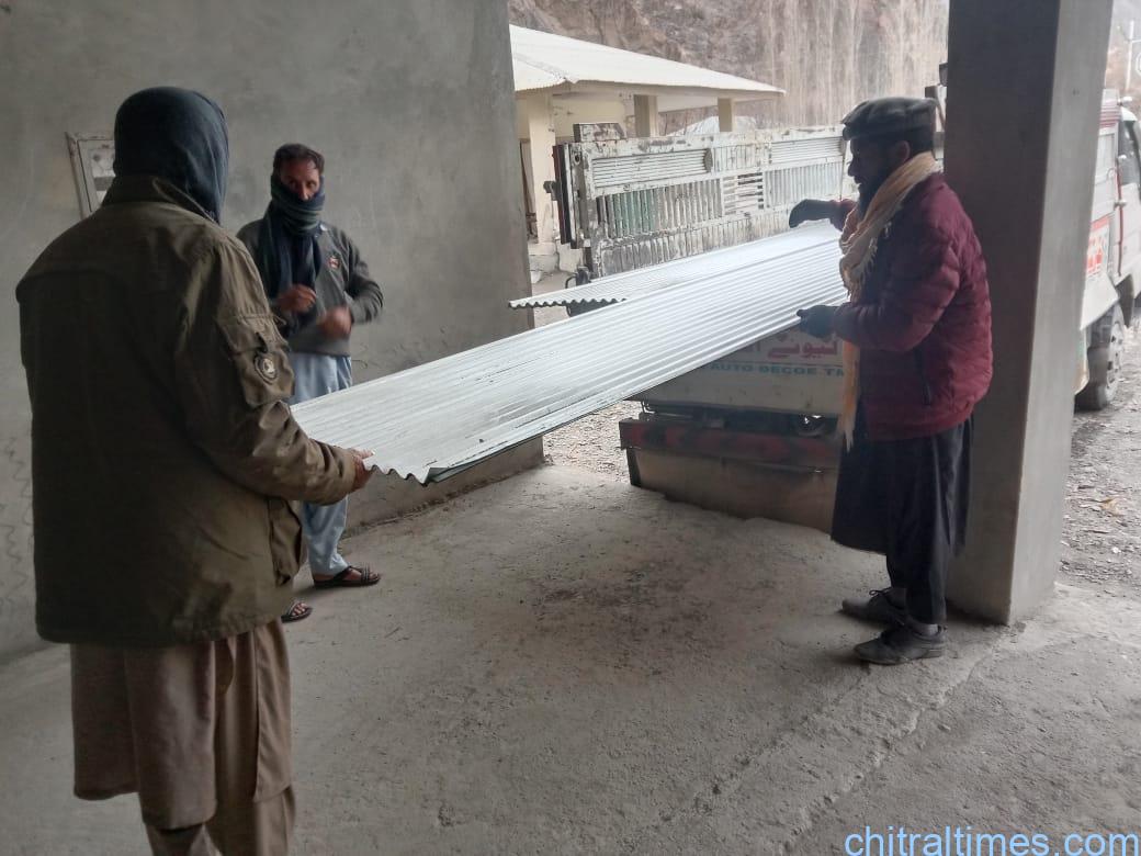 chitraltimes qari faizullah distributes steel sheets for flood affected people of chitral 6