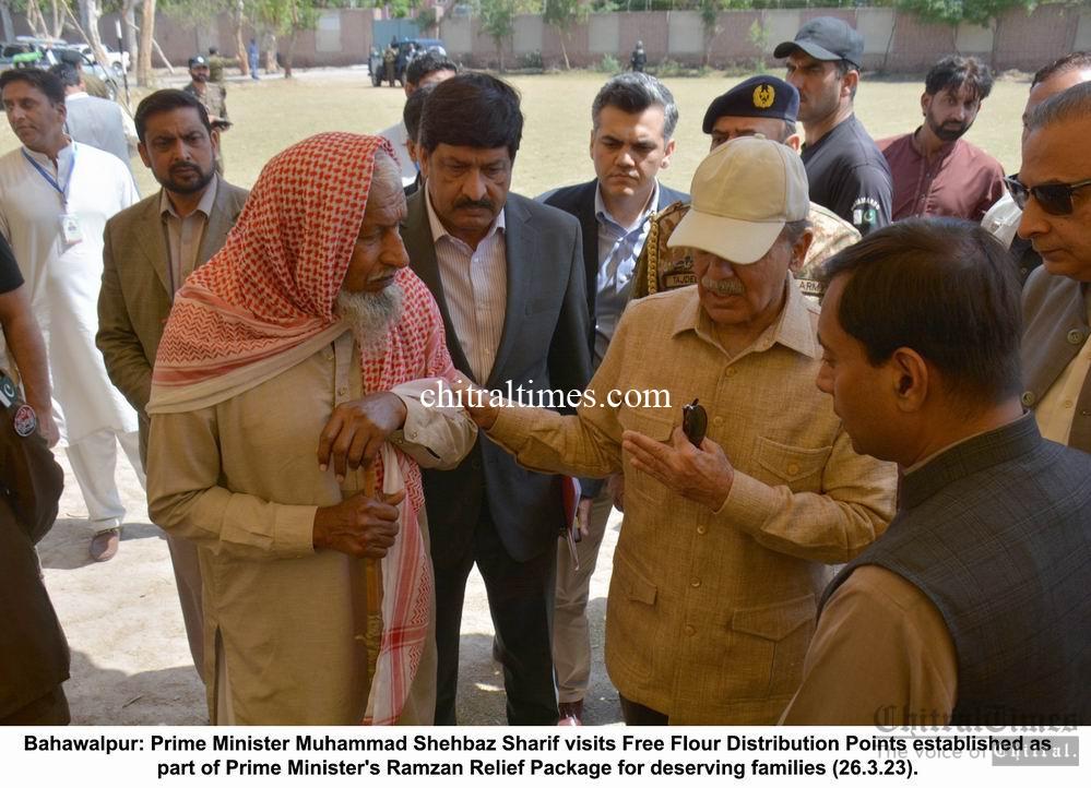 chitraltimes pm shahbaz visit free flour distribution point on sunday