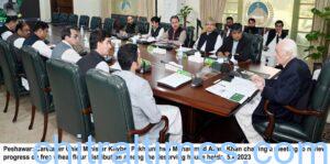 chitraltimes cm kp chairing meeting on wheat flour distribution
