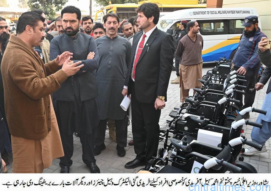 chitraltimes cm kp m sohail afridi giving away vehicles key to special education department 2
