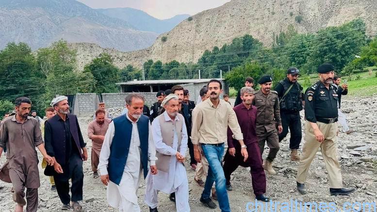 chitraltimes dc chitral lower visit flood hit area broze kol 5