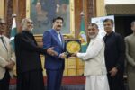 chitraltimes governor kp faisal kundi giving away shield to president chitral chamber mehboob azam 1