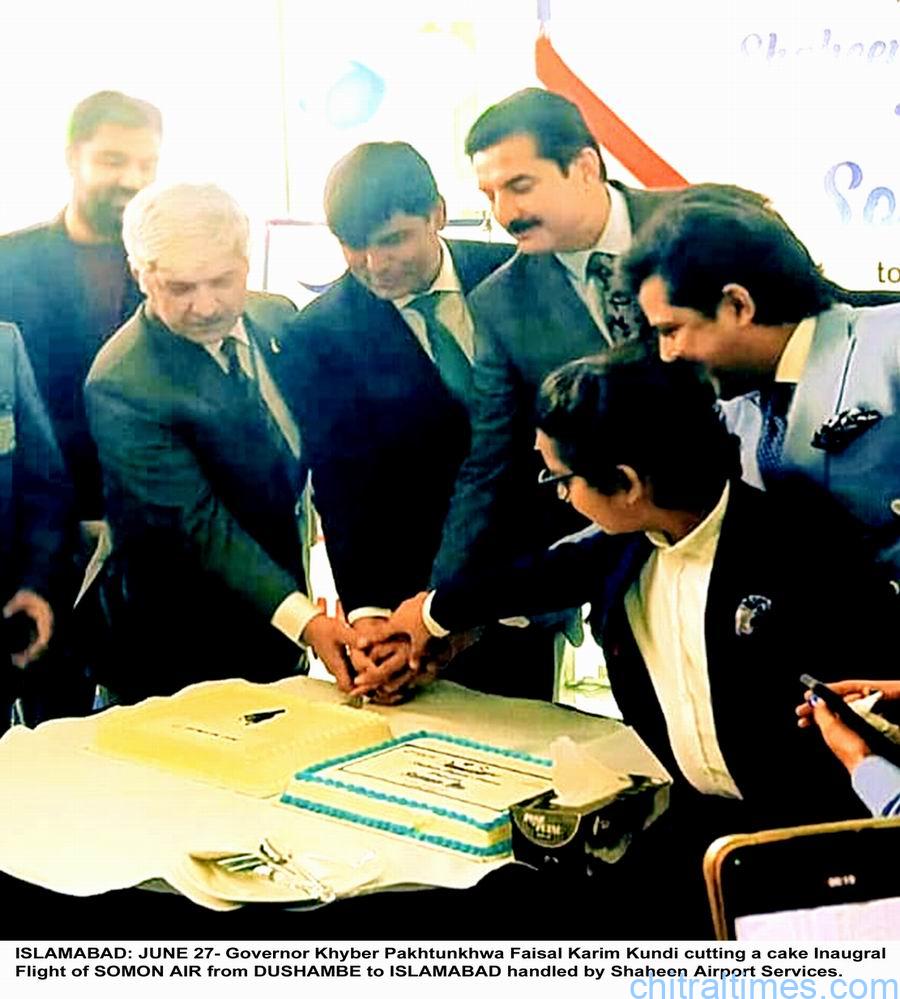 chitraltimes governor kp faisal kundi with officials on somon air flights inaugral cermony isb cake cutting ceremony