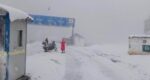 chitraltimes snowfall clearence lowari tunnel road dir side with mile stone2